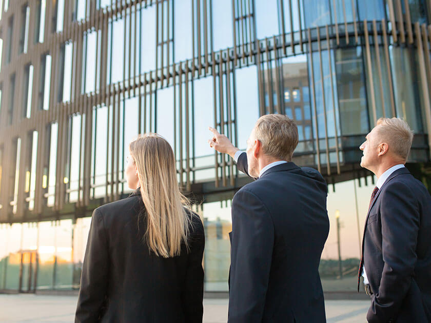 Business Team Outside Glass Building